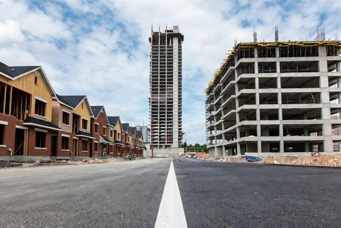 Townhouses beside a concrete structure