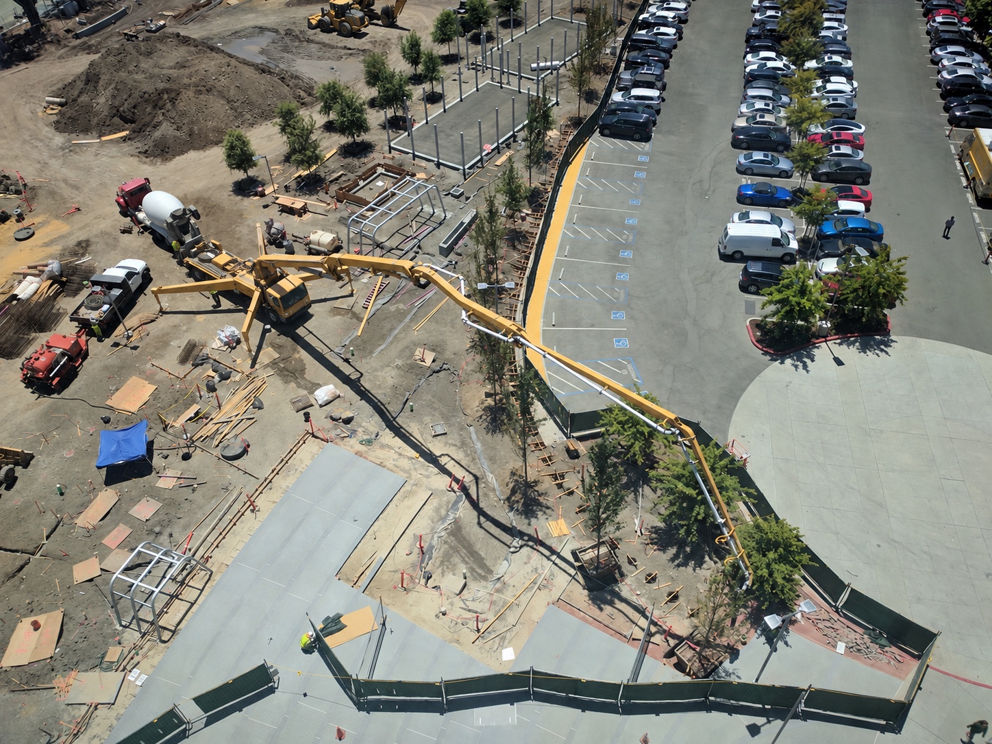Aerial view of a concrete pump, mixer and loader at a slab construction site in Sunnyvale, California